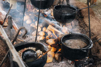 Lamb soup over fire