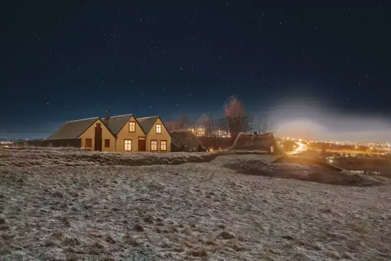 Árbær at evening in winter