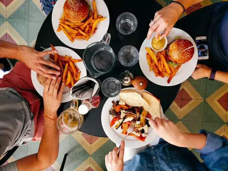 People eating hamburgers