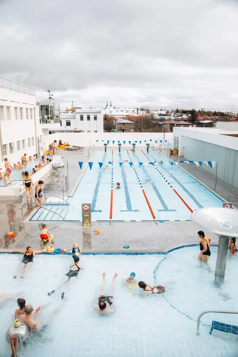 Guests at a geothermal swimming pool in Reykjavík