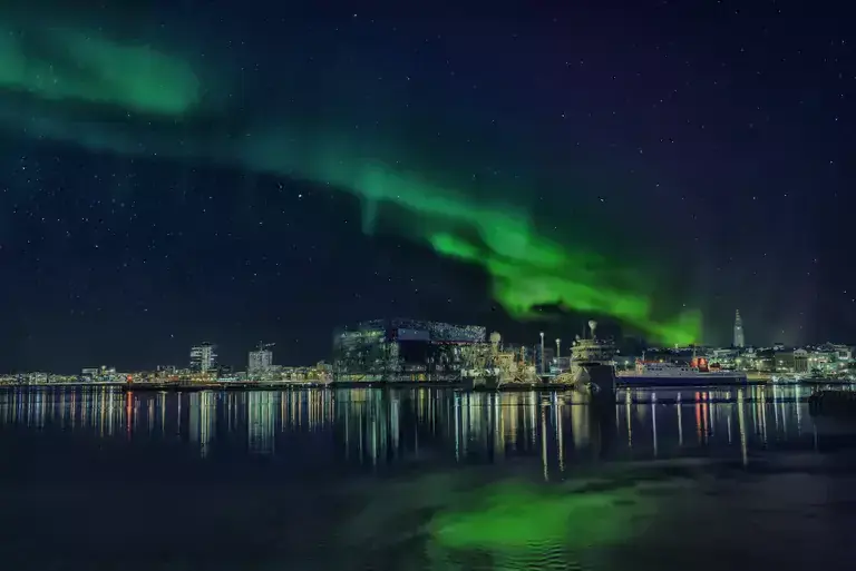 The northern lights over Reykjavík skyline