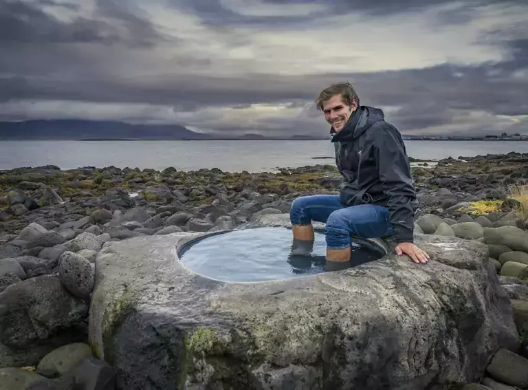 Man sitting with his feet in Cupstone artwork