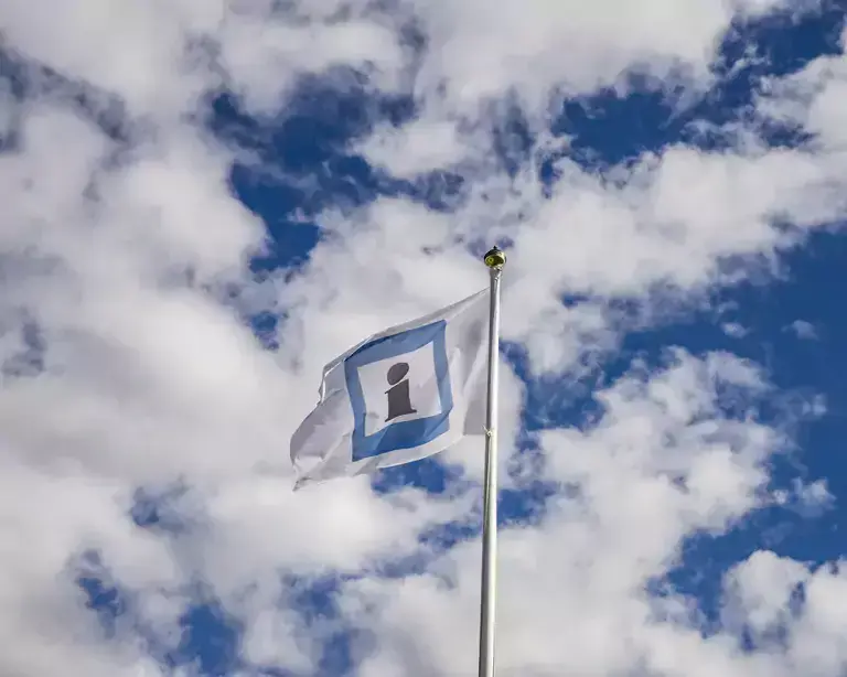 Information flag with the sky in the back