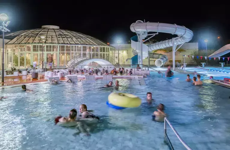 Árbæjarlaug pool at night 