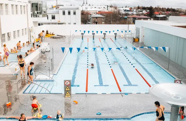 Guests at a geothermal swimming pool in Reykjavík