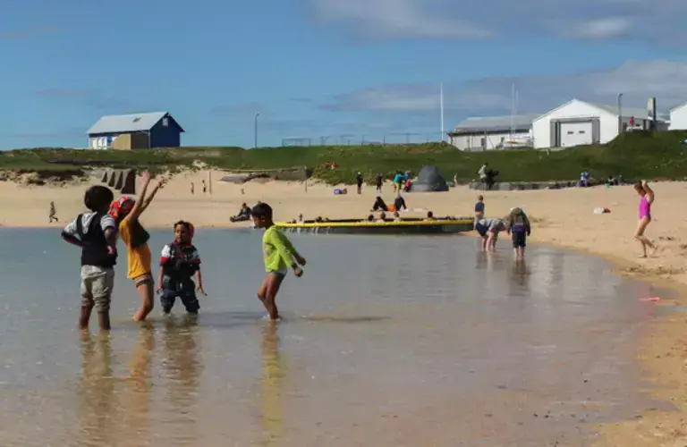 People playing on Nauthólsvík beach