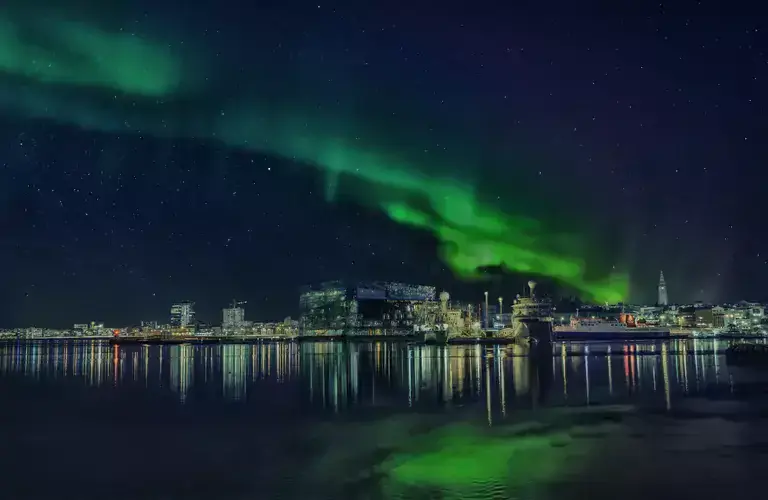 The northern lights over Reykjavík skyline